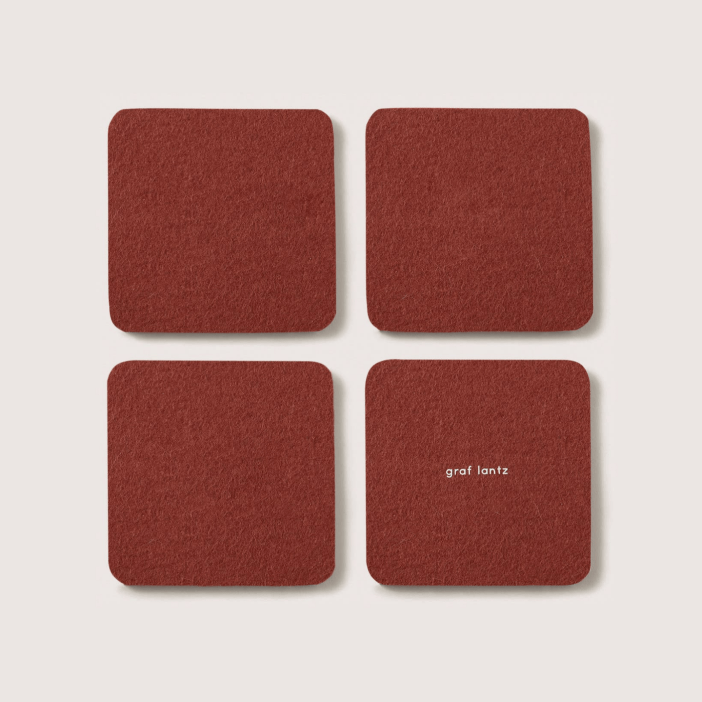 Graf Lantz · Bierfilzl Merino Wool Square Coaster Solid 4 Pack · Terracotta | socius design in Rochester, MN