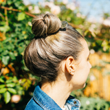 Botnia SPF Tube Key worn as a hairpin